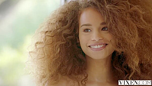 Stunningly hot curly ebony babe is having a great time while getting rammed from the back